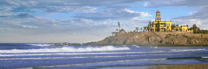 Waves on beach with Hacienda Cerritos hotel in the background, Cerritos Beach, Baja California Sur, Mexico