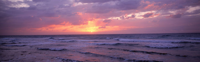 Cayman Islands, Grand Cayman, 7 Mile Beach, Caribbean Sea, Sunset over waves