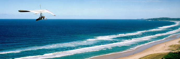 Hang glider over the sea