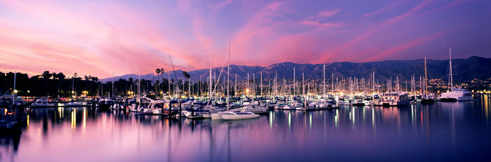 Boats moored in harbor at sunset, Santa Barbara Harbor, Santa Barbara County, California, USA