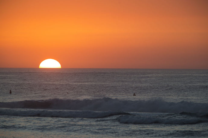 Waves in Pacific Ocean at sunset, Hawaii, USA