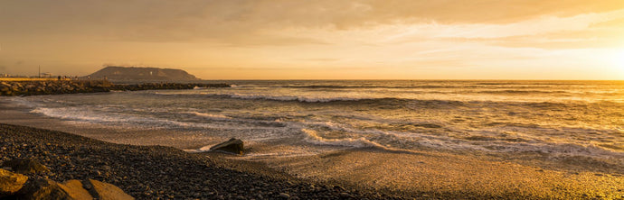 Surf on beach at dusk, Playa Waikiki, Miraflores District, Lima, Peru